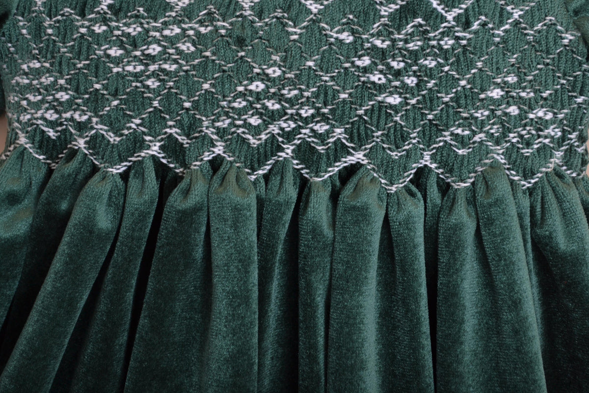 Clémence, Dress with short petal sleeves, peter pan collar, smocked waist, zipped back opening, in Emerald green velvet