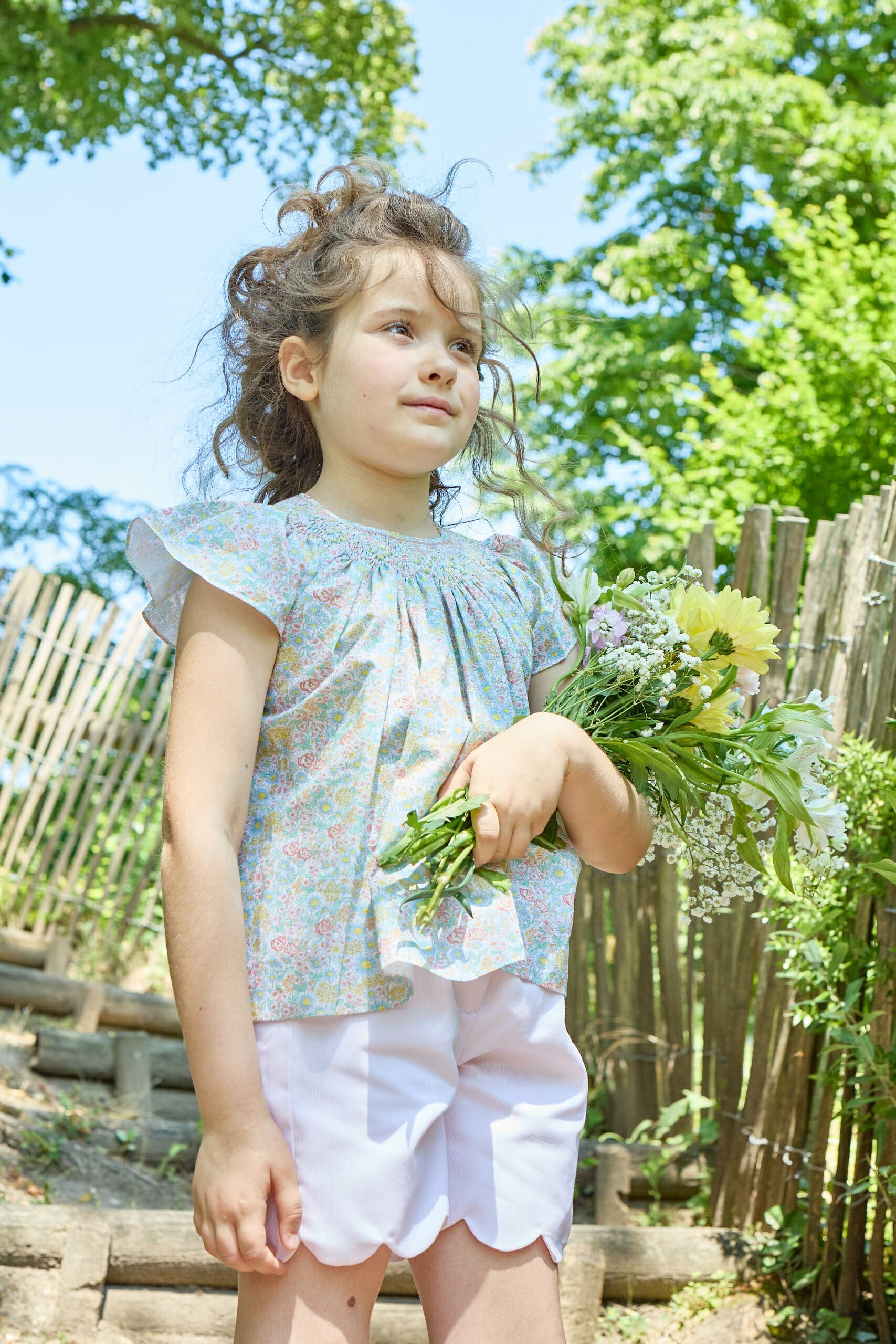Bergénie, smocked girl blouse, in Coral yellow floral print