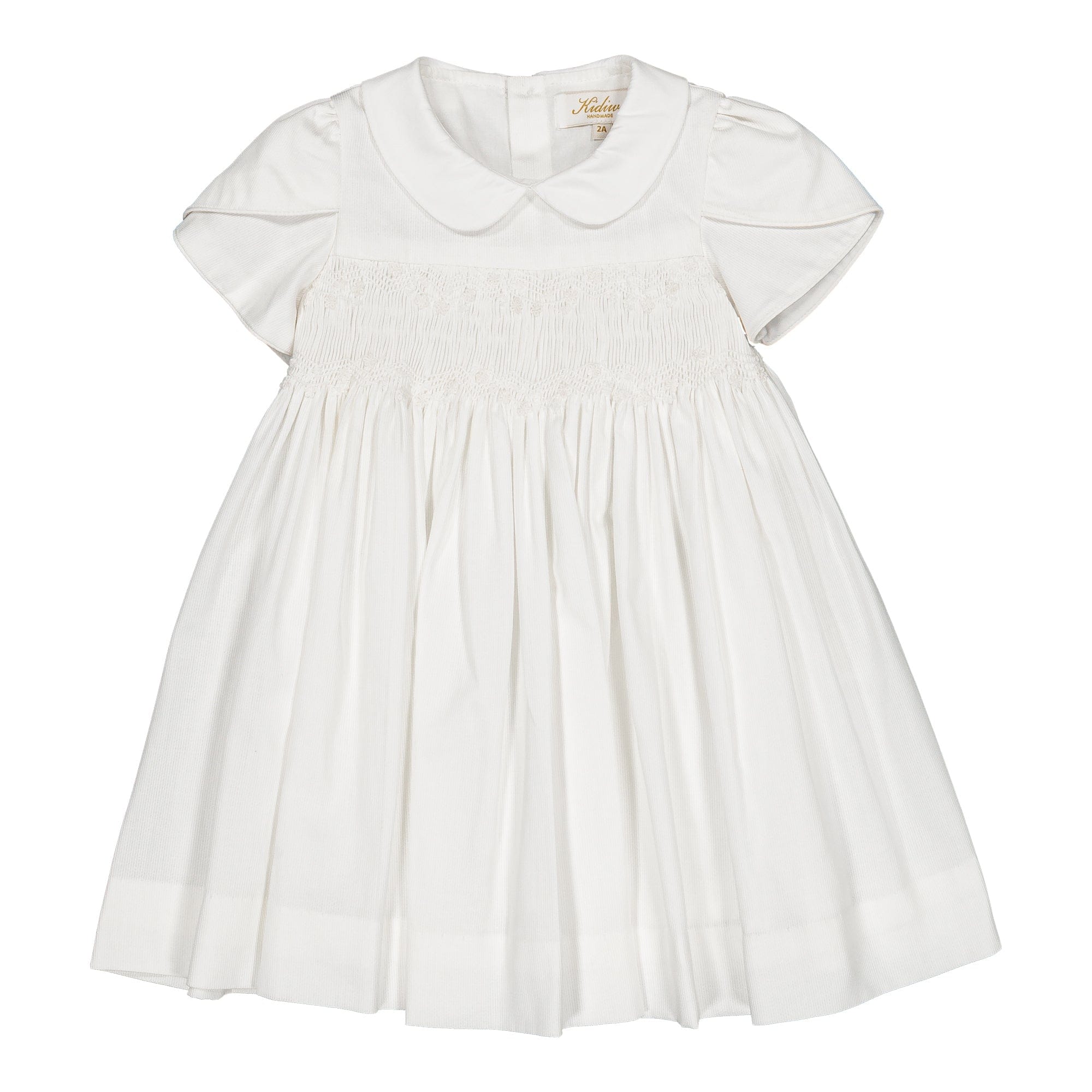 Clémence, robe smockée, en piqué de coton blanc