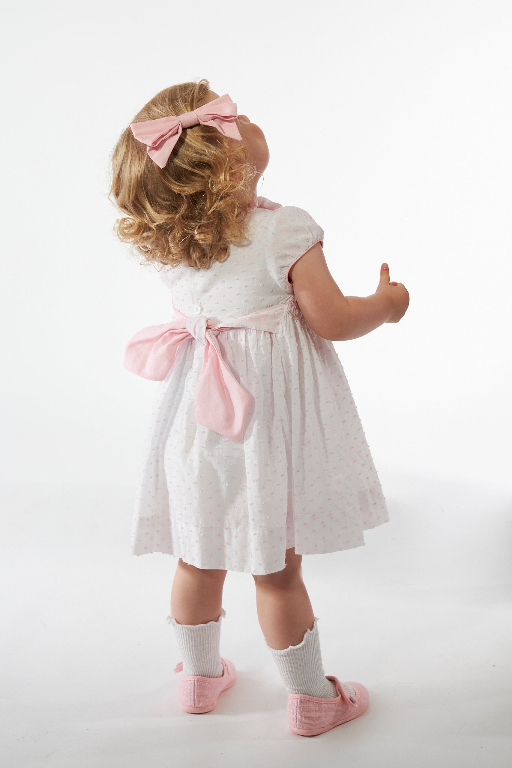 Hars, smocked dress, in White veil with pink plumetis