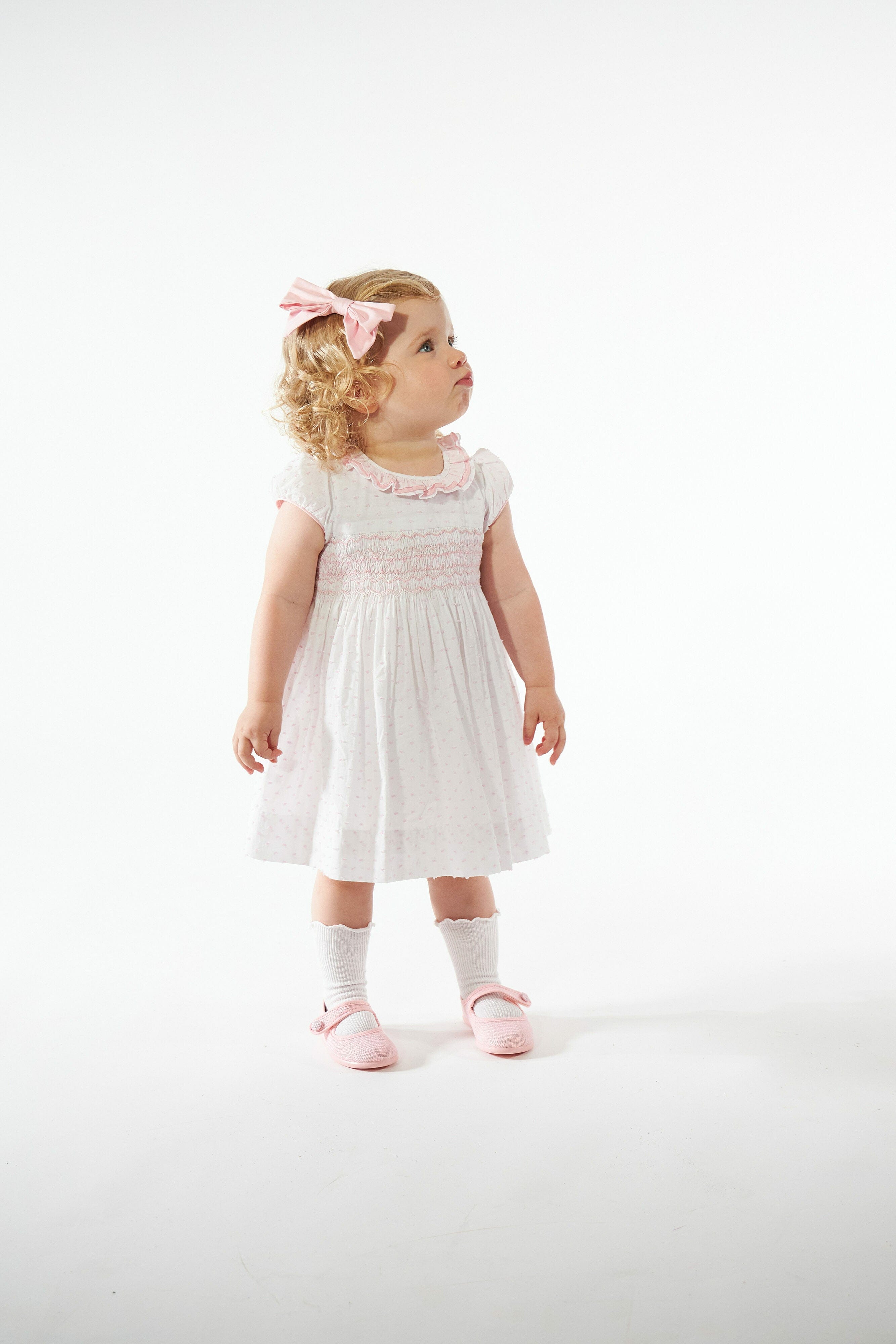 Hars, smocked dress, in White veil with pink plumetis