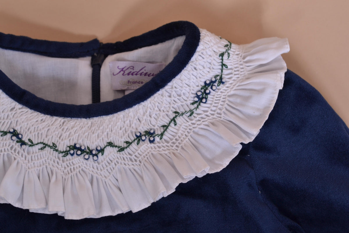 Swann, Dress smocked and embroidered ruffle collar, rounded waist cutout, zipped back opening, in Navy velvet