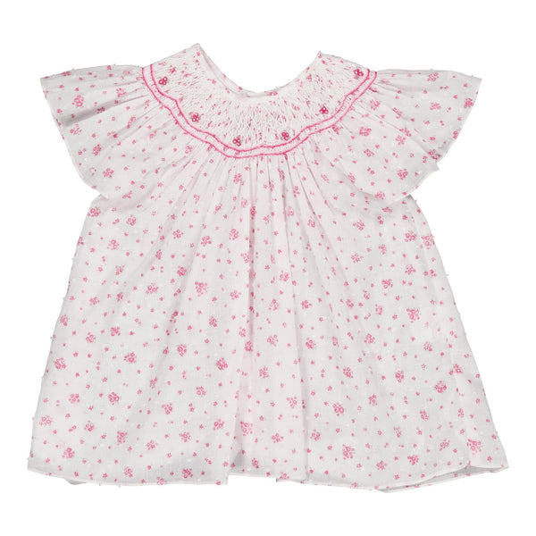 Bergénie, girl blouse with butterfly sleeves, smocked neckline, in White plumetis printed with small fuchsia flowers