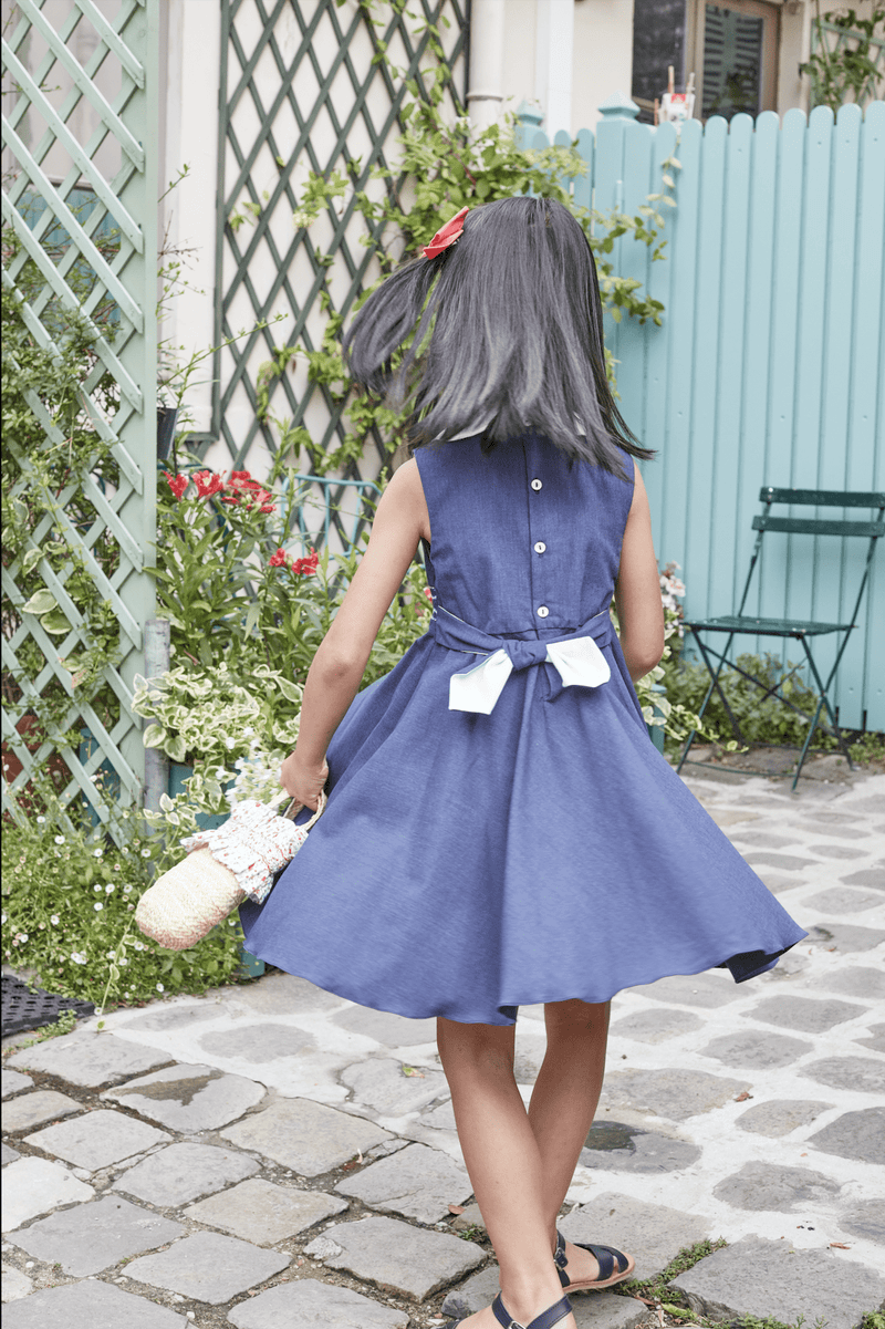 Fantine, smocked dress with white scalopped collar, bias cut skirt, in Jean chambray