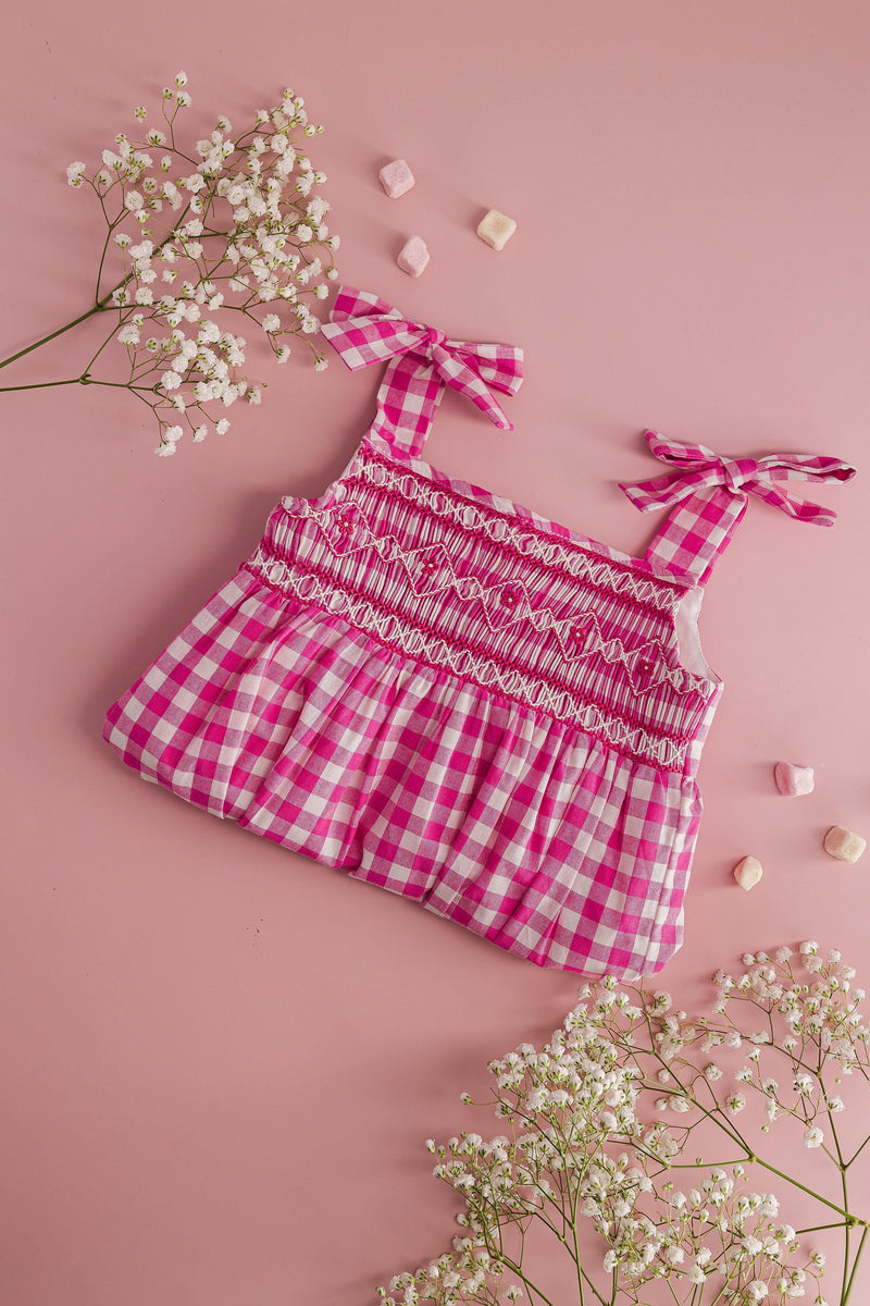 Francine, smocked baby girl romper with tied straps, in Large fuchsia gingham