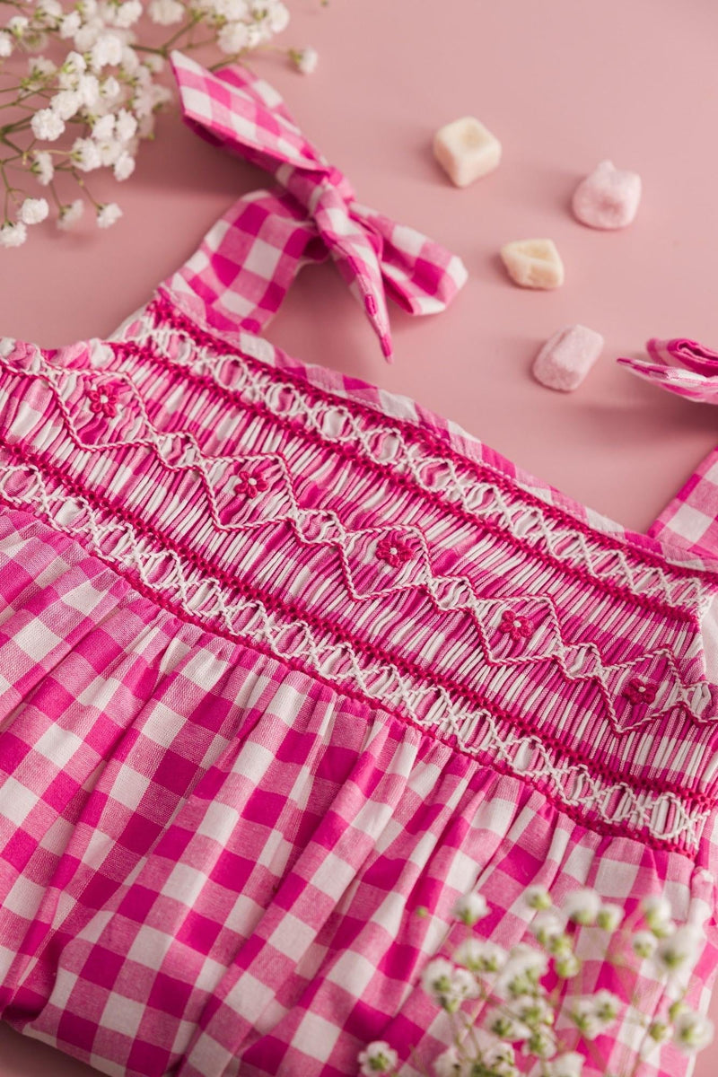 Francine, smocked baby girl romper with tied straps, in Large fuchsia gingham