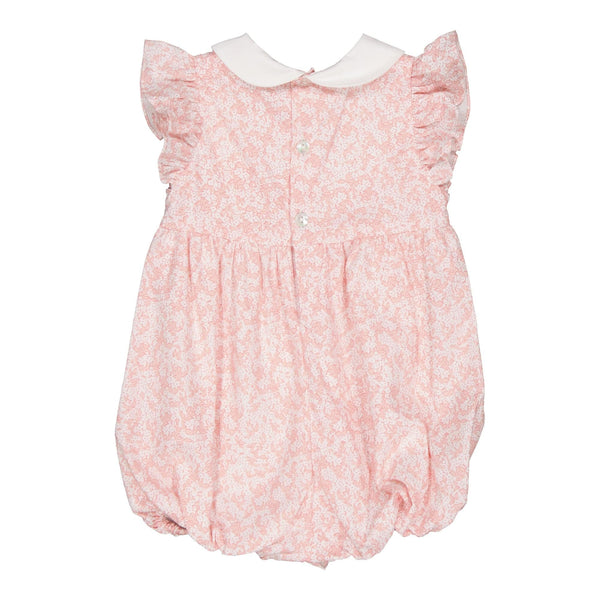 Julyne , smocked baby girl romper with ruffled sleeves and white Peter Pan collar, in Small nude pink print