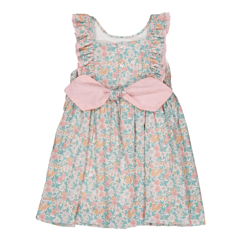 Mélina, smocked dress with two rows of ruffles at the neckline and back, in Coral and mint floral print