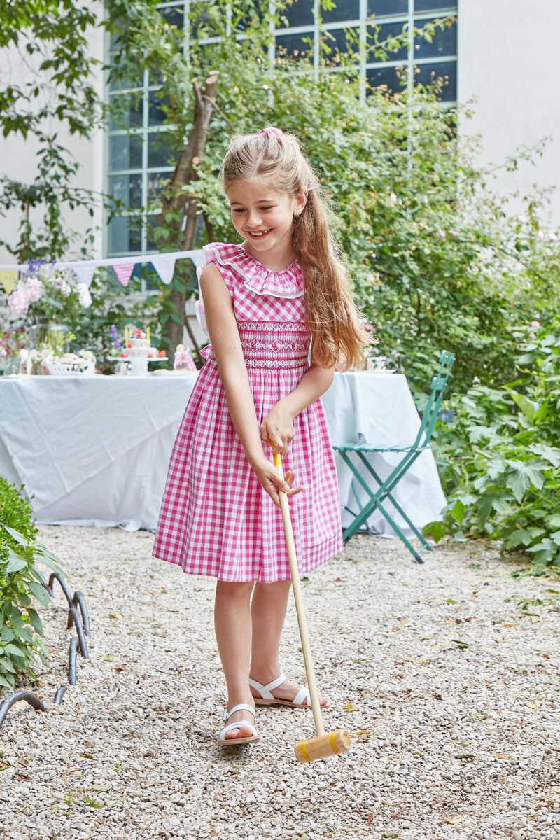 Mélina, smocked dress with two rows of ruffles at the neckline and back, in Large fuchsia gingham