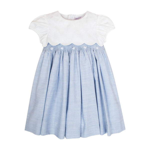 Festony, balloon-sleeved dress top in scalloped white cotton piqué, smocked bottom and embroidered at the waist in 1mm blue and white stripes