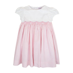 Festony, balloon-sleeved dress top in scalloped white cotton piqué, smocked bottom and embroidered at the waist in 1mm pink and white stripes