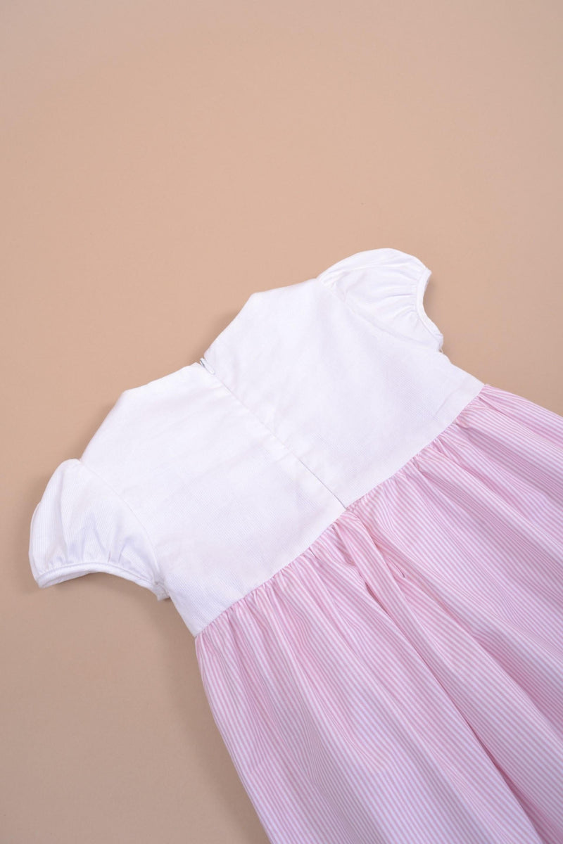 Festony, balloon-sleeved dress top in scalloped white cotton piqué, smocked bottom and embroidered at the waist in 1mm pink and white stripes