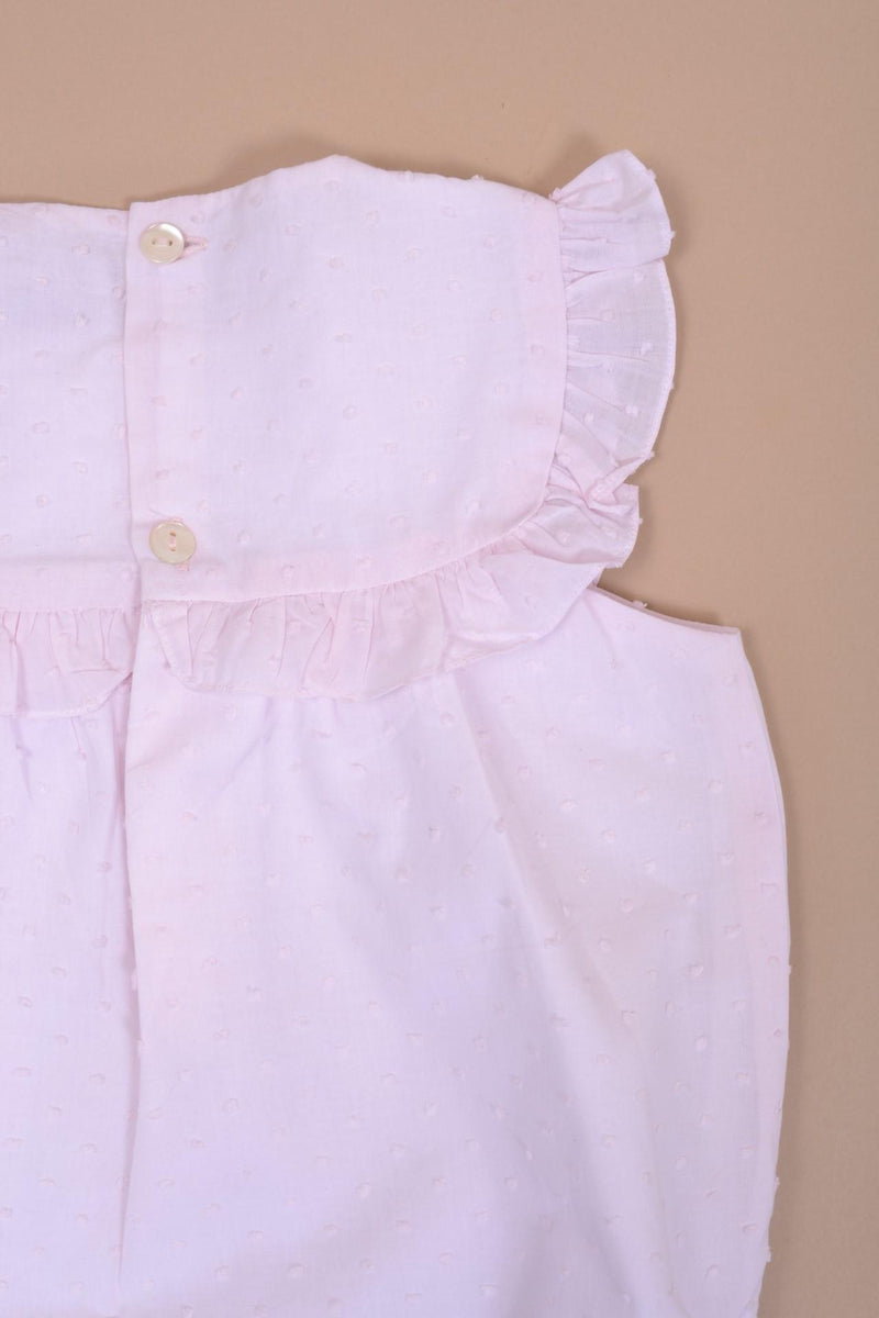 Horsia, Girl's sleeveless romper, embroidered and ruffled pleated bib front and back, opening at the bottom with 3 press studs, in baby pink plumetis