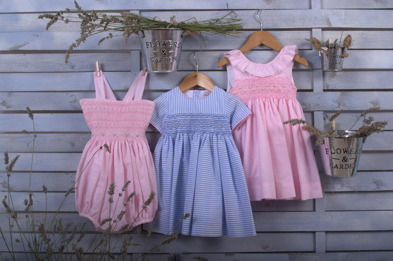 Pink striped smocked dress with a ruffled collar