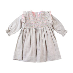 Robe smockée rose à plastron volanté en viyella gris clair