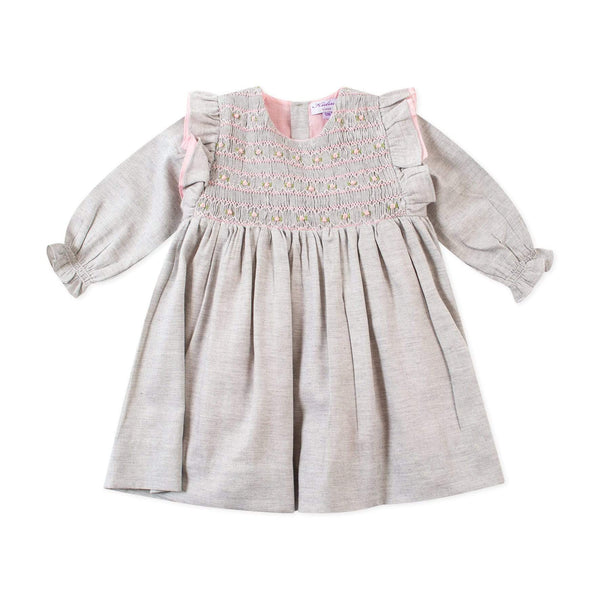 Robe smockée rose à plastron volanté en viyella gris clair